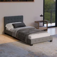 Pat modern tapițat gri într-un dormitor minimalist